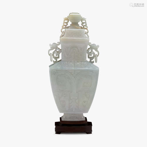 A Chinese carved archaistic jadeite covered vase, late qing dynasty