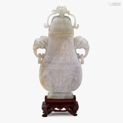 A small Chinese jadeite covered vase with twin elephant ring handles, 19th century