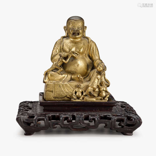 A Chinese gilt-bronze seated figure of Hvashang Moheyan, 18th century