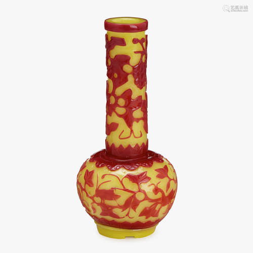 A rare Chinese red overlay on yellow glass footed bottle vase, with mantis and prey among vines, 18th / 19th century