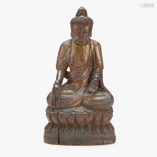 A Chinese gilt-lacquered wood figure of Shakyamuni seated on a double lotus base, ming dynasty