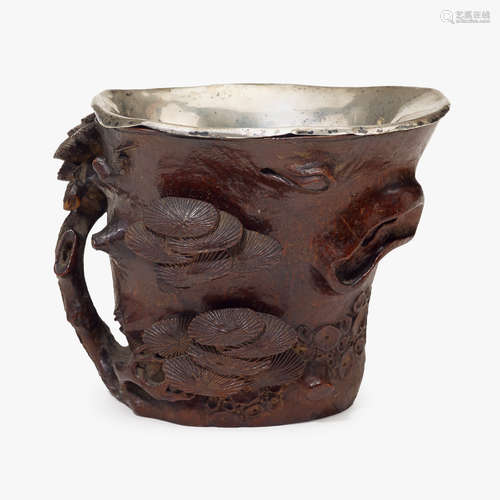 A Chinese carved 'pine tree' bamboo cup with silver insert liner, 17th/18th century