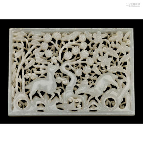 A Chinese white jade reticulated plaque with deer in foliage, ming dynasty