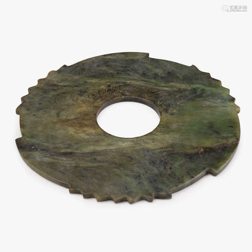 A Chinese spinach jade 'bi' disc, ming dynasty