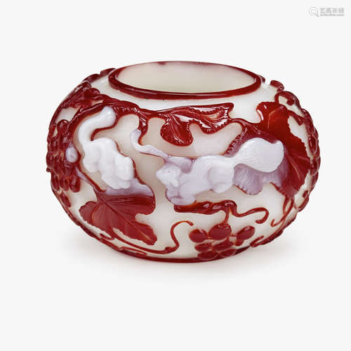 A Chinese burgundy-red and pearlescent-white overlay on milk glass brush washer, with squirrel and grapes, 19th century