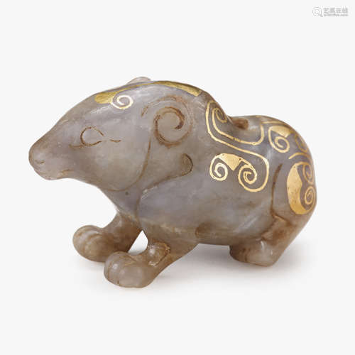 A Chinese gray jade and gilt-decorated toggle of a mythical creature, qing dynasty or earlier