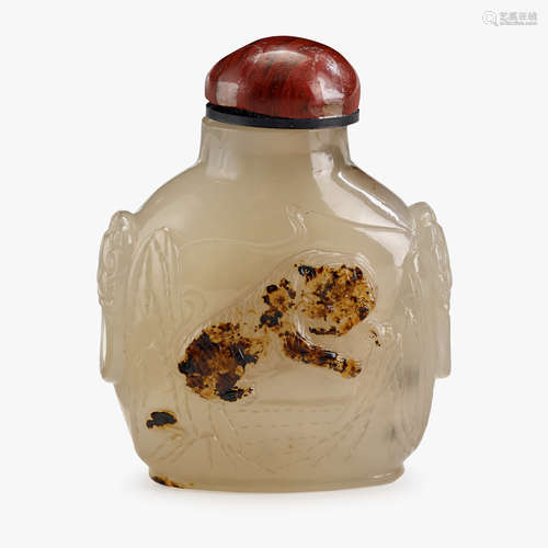 A Chinese cameo agate snuff bottle, carved with tiger and boats, qing dynasty