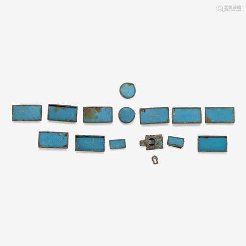 A collection of fourteen Chinese blue glass on wood-back belt plaques, ming dynasty