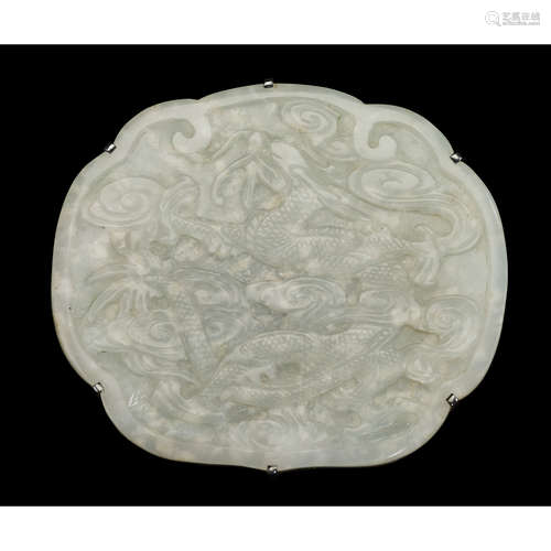 A Chinese white jade round belt plaque carved to show dragon, qing dynasty