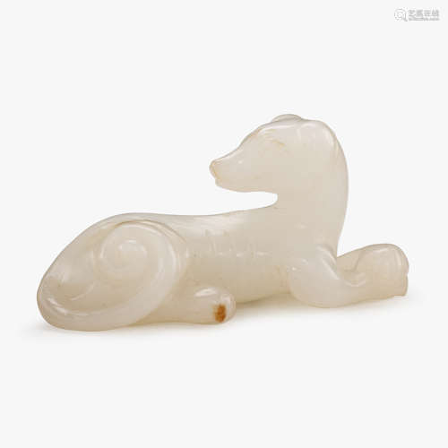 A Chinese white jade recumbent hound, 19th century