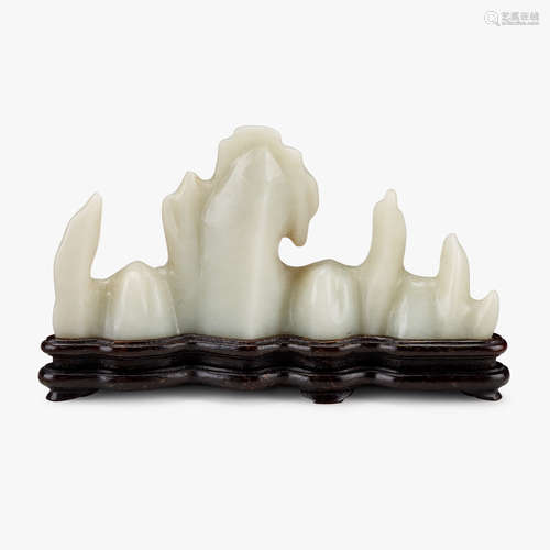 A Chinese celadon jade mountain-form brush rest, qing dynasty