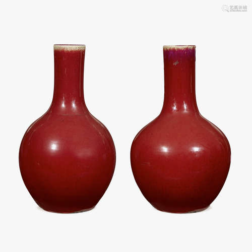 A near pair of Chinese oxblood glazed porcelain bottle vases, 18th century