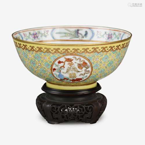 A Chinese yellow ground famille rose enameled porcelain 'baijixiang' bowl, iron-red six character tongzhi mark and of the period