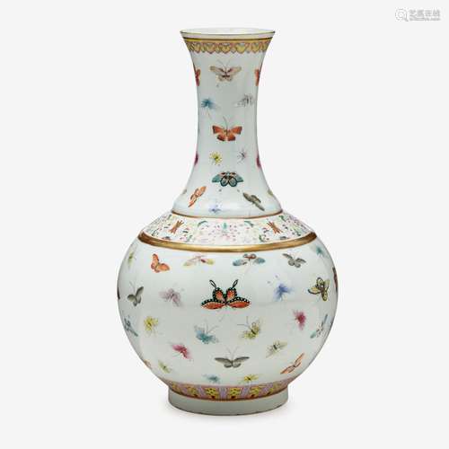 A Chinese famille rose enameled porcelain 'butterfly' bottle vase, iron red guangxu six character mark and of the period