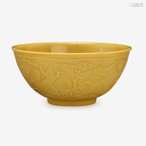 A Chinese yellow glass bowl, carved with warrior figures, qianlong four-character wheel-cut mark within a square and of the period