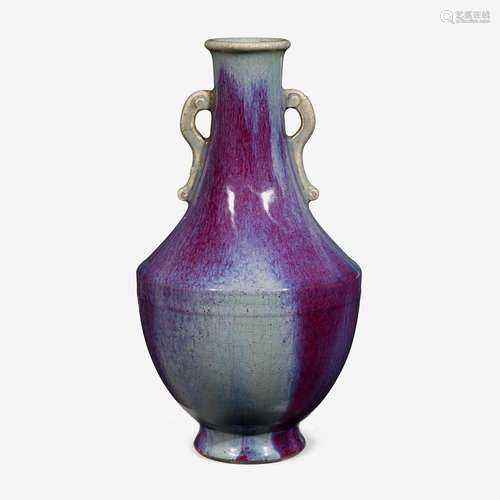 A Chinese flambé glazed porcelain bottle vase with twin handles, incised daoguang six character seal mark and of the period