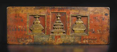 14th Century or earlier A POLYCHROMED AND GILT-WOOD MANUSCRIPT COVER TIBET