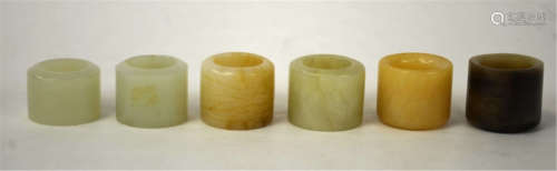 Six Chinese Carved Arch Jade Rings