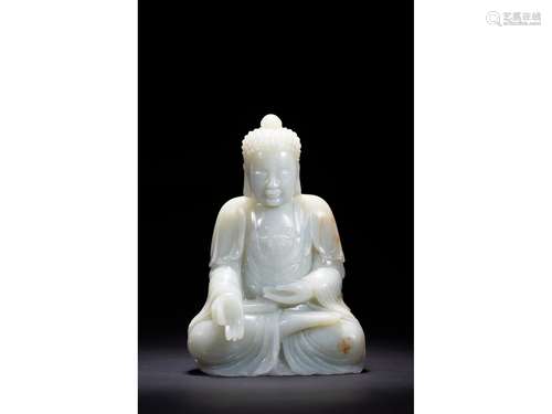 A WHITE JADE SEATED SHAKYAMUNI