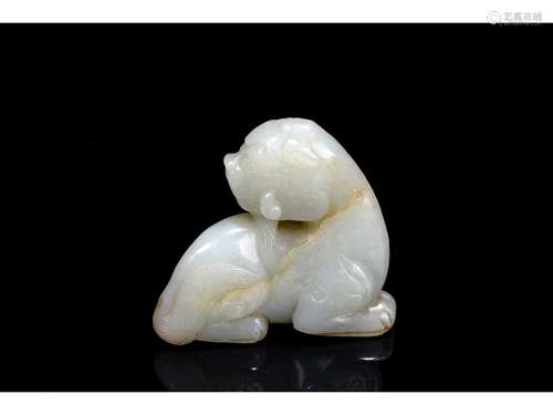 A WHITE JADE CARVED MYTHICAL BEAST