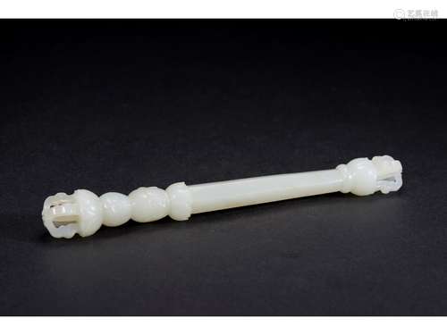 A WHITE JADE CARVED TIBETAN SKULL CLUB