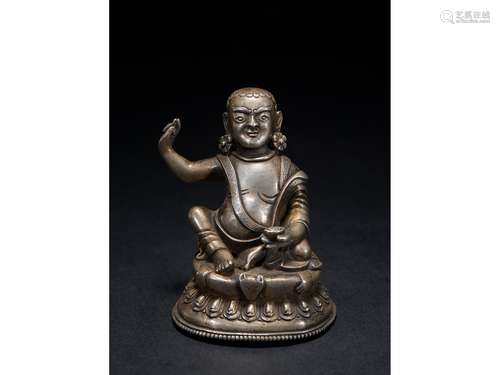 A SMALL SILVER FIGURE OF MILAREPA