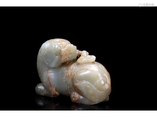 A WHITE AND RUSSET JADE MYTHICAL BEAST