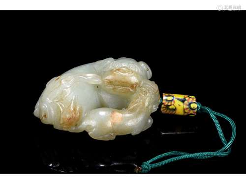 A WHITE JADE CARVING OF MYTHICAL BEAST