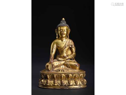 A GILT-BRONZE FIGURE OF SHAKYAMUNI