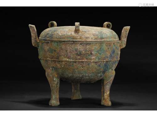 AN ARCHAIC BRONZE TRIPOD CENSER