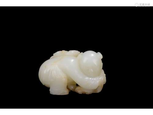 A WHITE JADE CARVING OF BOY AND LINGZHI