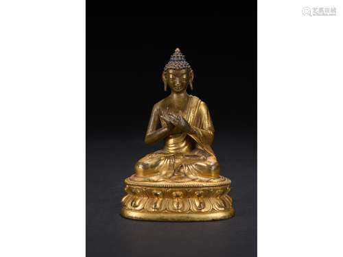 A GILT-BRONZE FIGURE OF SHAKYAMUNI