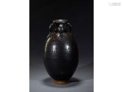 A BLACK GLAZED FOUR-EAR JAR