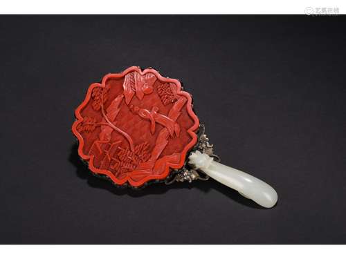 A CINNABAR LACQUER AND WHITE JADE HAND MIRROR