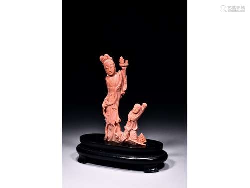 A CORAL CARVED FIGURAL GROUP