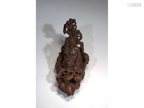 AN AGARWOOD CARVING OF 'IMMORTAL ON BOAT'