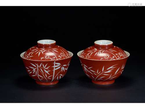 A PAIR OF CORAL RED RESERVE-DECORATED BOWLS