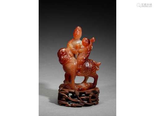 AN CARNELIAN AGATE CARVED FIGURAL GROUP