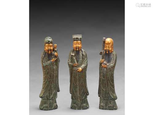 A GROUP OF THREE LARGE PORCELAIN FIGURES OF IMMORTALS