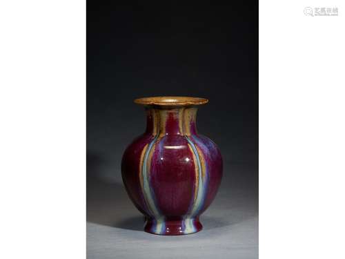 A FLAMBE GLAZED POMEGRANATE LOBED VASE