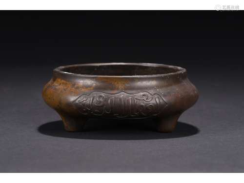 A BRONZE 'ARABIC INSCRIPTION' TRIPOD CENSER