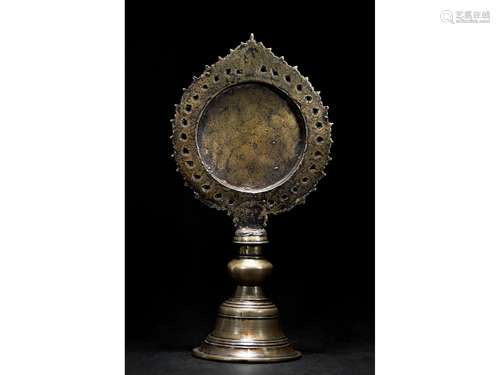 A TIBETAN BRONZE ALTAR MIRROR STAND