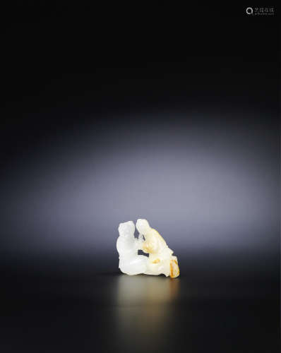 A small white and russet jade carving of two figures;19th/20th century