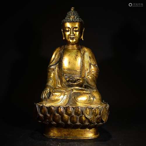 A GILT BRONZE SHAKYAMUNI FIGURE STAND