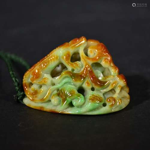 A CARVED JADEITE PENDANT