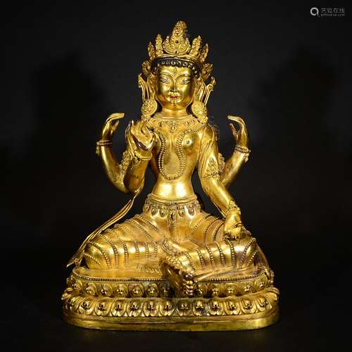 QING D., A GILT BRONZE FOUR-ARM GUANYIN FIGURE