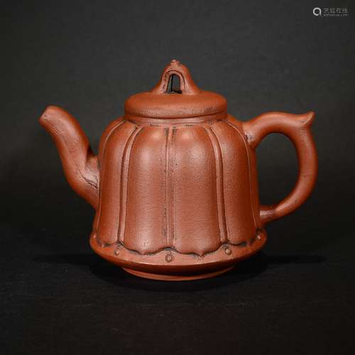 A RED STONEWARE TEAPOT