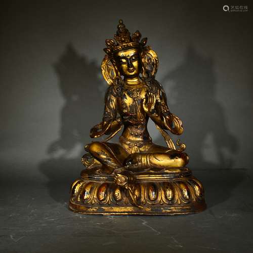 A GILT BRONZE GREEN TARA FIGURE