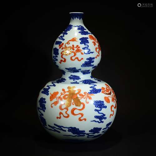 QIANLONG MARK, A BLUE AND WHITE GOURD SHAPE VASE