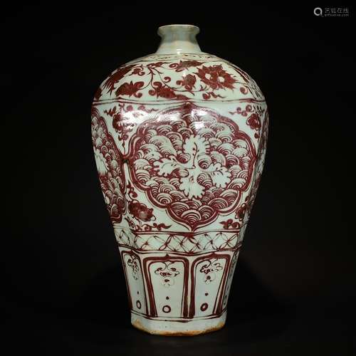 A UNDERGLAZED RED VASE WITH WAVE PATTERN